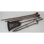 An early 19th century 3 piece steel fire iron set and two vintage walking canes. (5). Condition