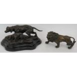 A bronze sculpture of two hunting dogs mounted on a black marble plinth, signed Barye and a bronze