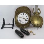 A 19th century Art Nouveau French striking wall clock with enamel dial and repoussé brass mount