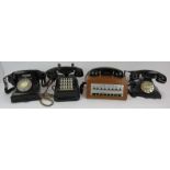 Two vintage switchboard telephones, a black Bakelite telephone and a modern digital vintage style