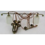 An antique brass 2 lamp rise and fall ceiling light fitted with moulded Art Deco shades, plus 2