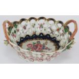 An 18th century first period Worcester porcelain chestnut basket with interior floral decoration,