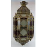 A large Indo-Persian style lantern of pierced gilt metal and red and blue stained glass. Overall