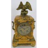 A 19th century French Empire Revival striking mantle clock of amber marble with gilt metal mounts.