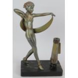 An Art Deco figural table lighter in the style of Lorenzl, featuring a female dancer mounted on a