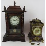 An Edwardian oak cased lantern style mantel clock with gilt brass mounts and enamelled dial and a