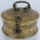 A fine late 19th/early 20th century betel nut box or paan. Ornately chased and with chain style