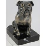 A French Art Deco figure of a bulldog mounted on a marble plinth signed Franjou. Silvered metal with