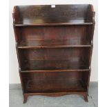 A 19th century mahogany waterfall open bookcase of four graduated shelves, on outswept bracket feet.