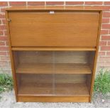 A mid-century teak bureau bookcase by Herbert E Gibbs, the fall front bureau section with fitted