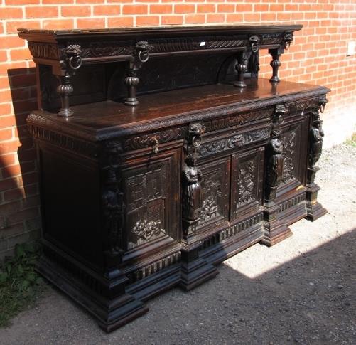 A large oak 19th century sideboard, ornately carved in a 16th century taste with lion masks and - Image 2 of 4