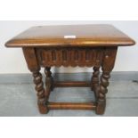 A 19th century oak joint stool in a 17th century taste, with chisel carved frieze, on barley twist