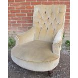 A Victorian button back low bedroom armchair, upholstered in beige draylon with rope braiding, on