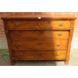 A 19th century Italian fruitwood chest of four long drawers with brass drop-ring handles and lock