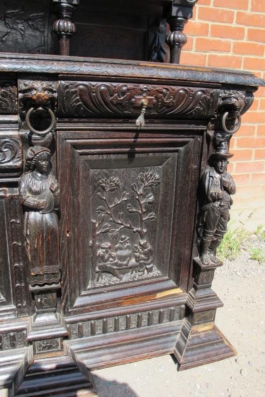 A large oak 19th century sideboard, ornately carved in a 16th century taste with lion masks and - Image 4 of 4