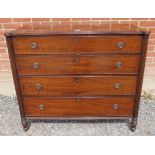 A Regency mahogany chest of four graduated cock-beaded drawers with brass drop ring handles and lock