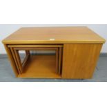 A mid-century teak ?Tristor? turnover extending coffee table by McIntosh, housing two nesting