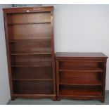 A reproduction mahogany period style tall open bookcase of five height adjustable shelves, flanked