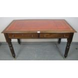 A 19th century mahogany writing desk, with inset gilt tooled red leather writing surface, housing