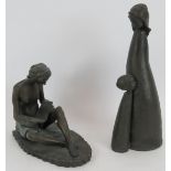 A bronzed composite figure of a girl reading and a similar figure of a mother and child. tallest