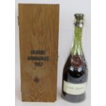 A bottle of Janneau Grande Armagnac Brandy vintage 1962, bottle No 52, bottled 1987 to celebrate
