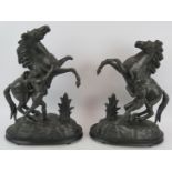 A pair of hollow cast spelter Marley horses in black finish. Tallest 47cm. (pr). Condition report: