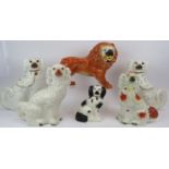 Five 19th century Staffordshire pottery Wally dog spaniels including a pair with glass eyes, plus