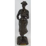 An antique French bronze figure of a lady 'La Note Aquittée' Exposition Des Beaux Arts Paris 1900.