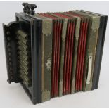 An early 20th century German accordion with trademarked tin plate mounts. Condition report: Hand