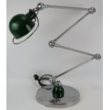 A very cool vintage Jieldé four arm industrial style lamp with heavy chrome base. Suitable as