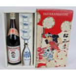 A presentation box of Sakura-Masamune Japanese Sake with serving bottle and cups. Circa 1980s.