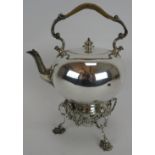 A turn of the century silver plated spirit kettle by Martin Hall & Co with cane work handle and