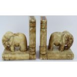 A pair of Art Deco style carved marble elephant book ends each with an elephant mounted on two