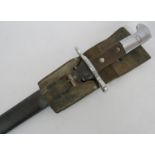 A Swiss military bayonet with scabbard and frog. Marked Waffen Fabrik Neuhausen. Seriel No: