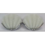 A pair of Art Deco style Odeon clam shell wall lights with moulded milk glass shades and chrome