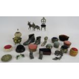 A collection of antique and vintage novelty pin cushions including a serpentine example, donkeys,