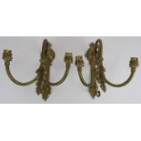 A pair of period style double sconce brass wall lights with acanthus leaf decoration and