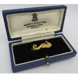 A pretty 9ct gold boxed seahorse brooch, box marked Captain O.M Watts Ltd London. Brooch stamped