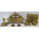 An aesthetic movement brass desk stand and ink wells, a pair of Gothic brass candlesticks, Art