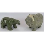 A Canadian Inuit carved green granite polar bear and a similar green granite yak. Tallest 14cm. (2).