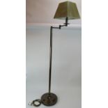 A contemporary floor standing reading lamp with moveable head. Bronzed metal base with square