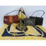 A vintage crocodile skin handbag and coin purse, a black lizard skin style hand bag, a beaded velvet