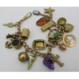 A 15ct gold charm bracelet, links marked 625, some charms marked 9ct, some unmarked. Total approx