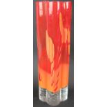A Mid-Century studio glass tall vase in orange hues, indistinct signature to base. Height: 35cm.