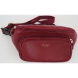 A burgundy grained leather Osprey waist bag bum bag with two pockets. Original dust bag. All