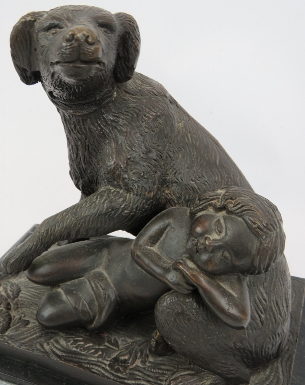 A bronze figure of a dog and sleeping child mounted on a black marble plinth. Signed B.M.18. - Image 4 of 4