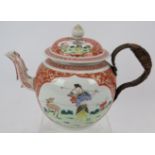 An 18th century Chinese porcelain teapot decorated with gilt and iron red surrounding traditional