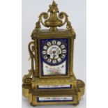 A 19th Century French bronze Ormulu striking mantel clock with hand decorated porcelain dial and