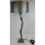 A large contemporary aluminium vine style table lamp on chrome base and with silver snake skin