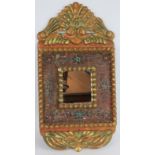 A gilt wood and gesso Spanish colonial style mirror with ornate gilt frame and hand decorate